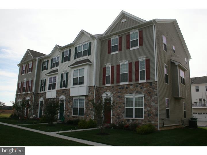 474 Aura Road Mullica Hill, NJ 08062 - Photo 2 of 21 a front view of a residential apartment building with a yard