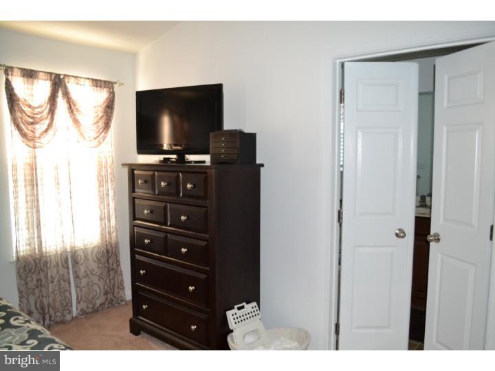 474 Aura Road Mullica Hill, NJ 08062 - Photo 15 of 21 a room with furniture and flat screen tv