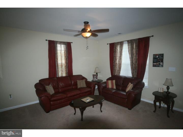 474 Aura Road Mullica Hill, NJ 08062 - Photo 3 of 21 a living room with furniture and a chandelier