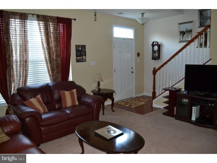 474 Aura Road Mullica Hill, NJ 08062 - Photo 4 of 21 a living room with furniture and a flat screen tv