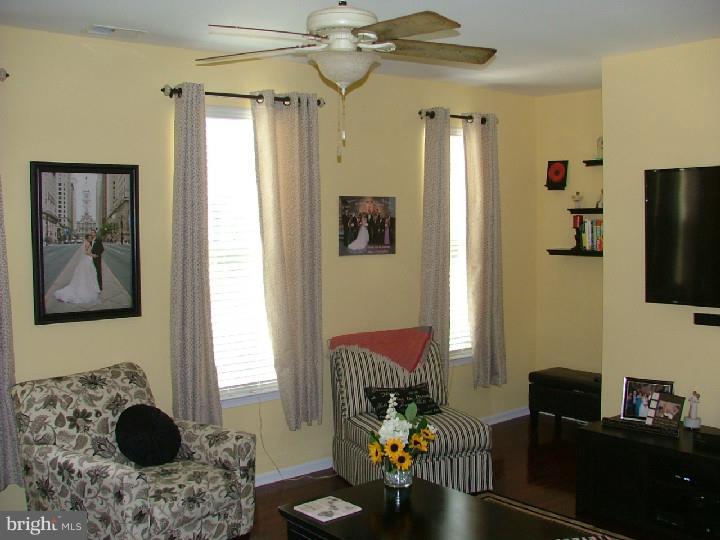 474 Aura Road Mullica Hill, NJ 08062 - Photo 7 of 21 a living room with furniture and a flat screen tv