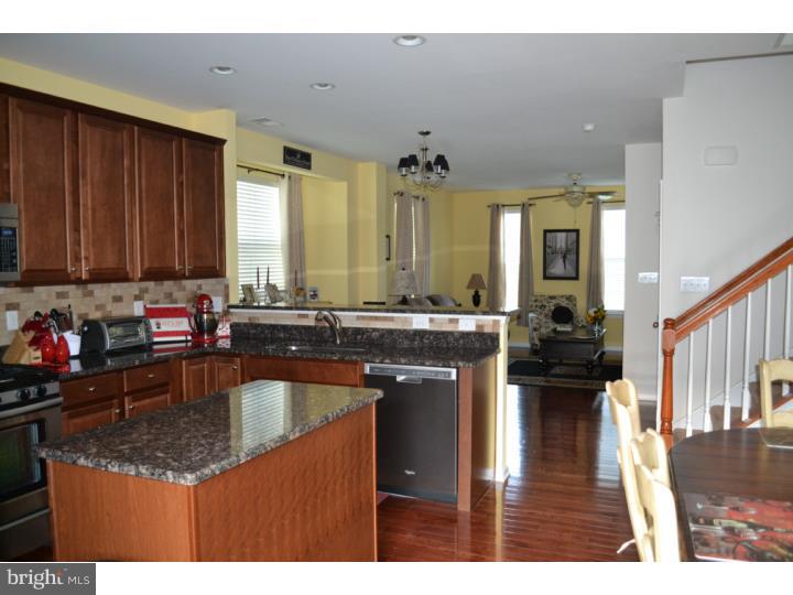 474 Aura Road Mullica Hill, NJ 08062 - Photo 10 of 21 a kitchen with kitchen island granite countertop a sink counter top space and appliances