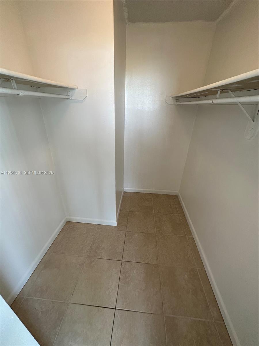 486 Northwest 165th Street, Unit B501 Miami, FL 33169 - Photo 8 of 14 a view of a room with shelf