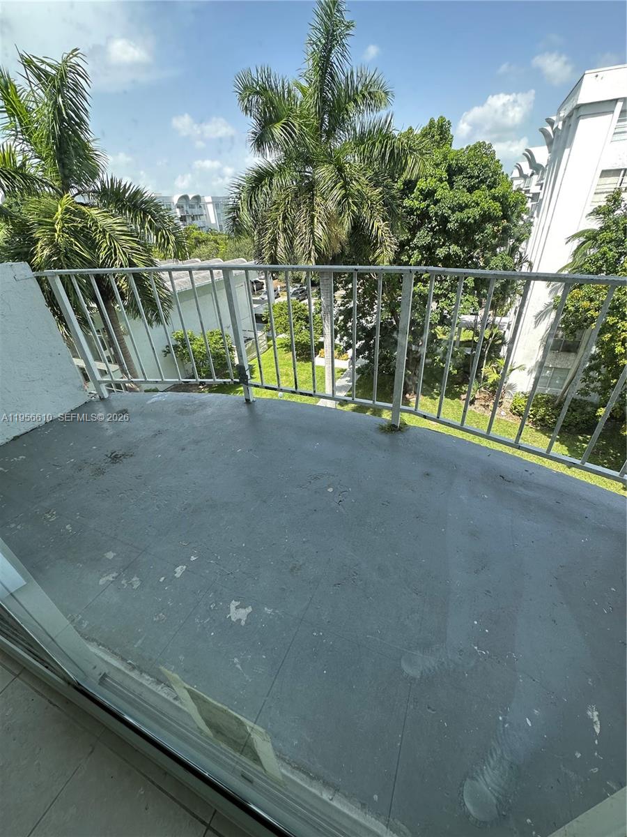 486 Northwest 165th Street, Unit B501 Miami, FL 33169 - Photo 10 of 14 a view of a street with a building in the background