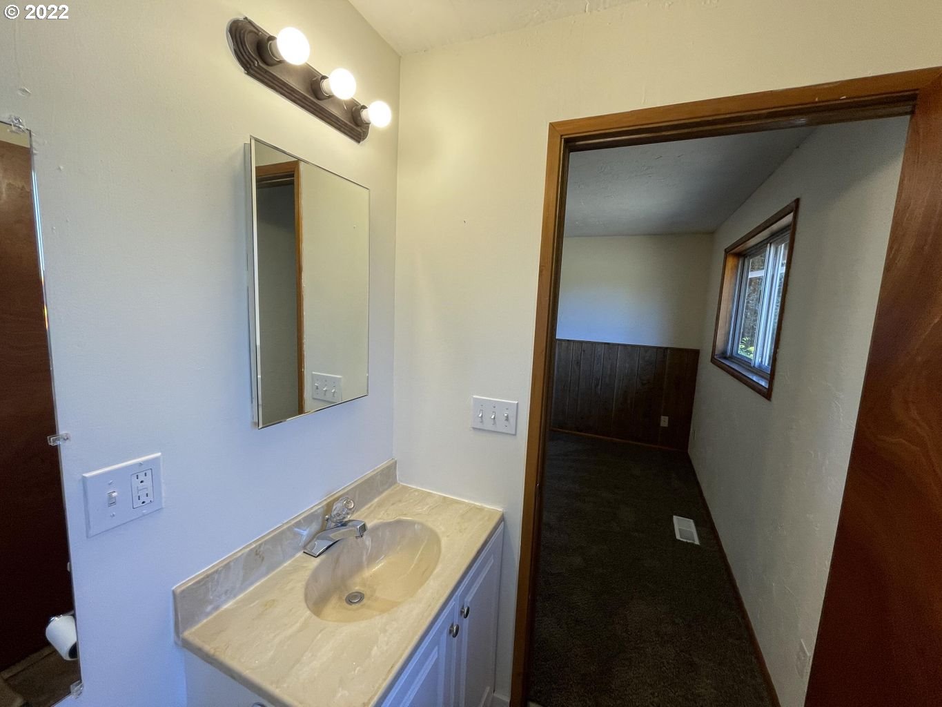5970 Brickyard Road Tillamook, OR 97141 - Photo 9 of 32 a bathroom with a sink and mirror
