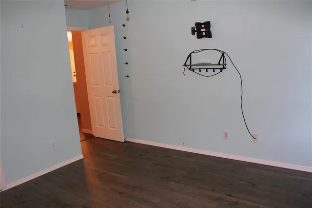 a view of an entryway with wooden floor