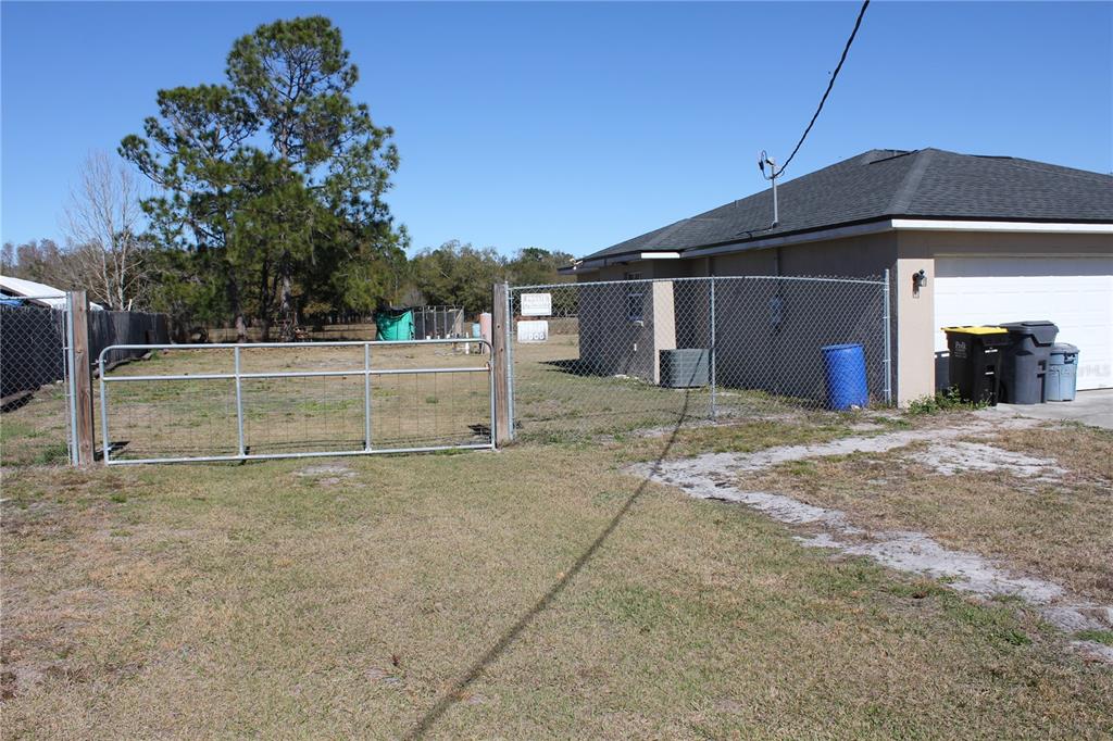7238 Evergreen Loop Polk City, FL 33868 - Photo 2 of 28 a view of a house with a yard