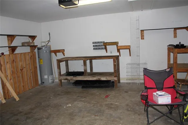 a bedroom with furniture and a book shelf
