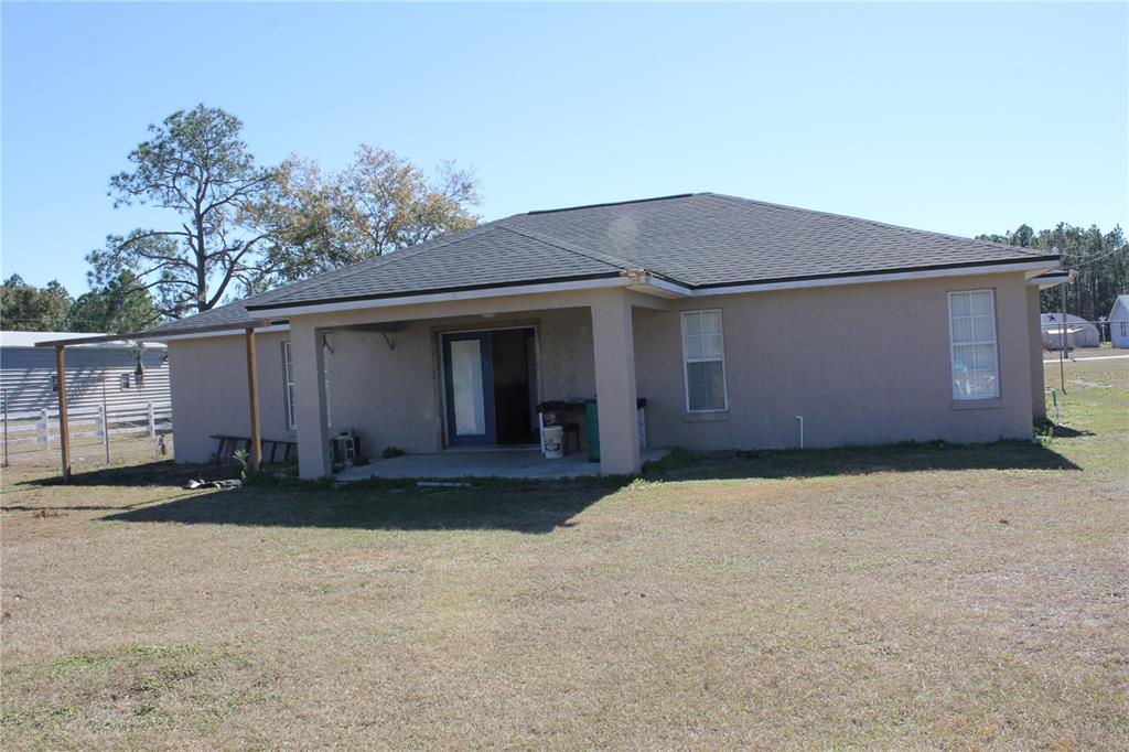 7238 Evergreen Loop Polk City, FL 33868 - Photo 25 of 28 a front view of a house
