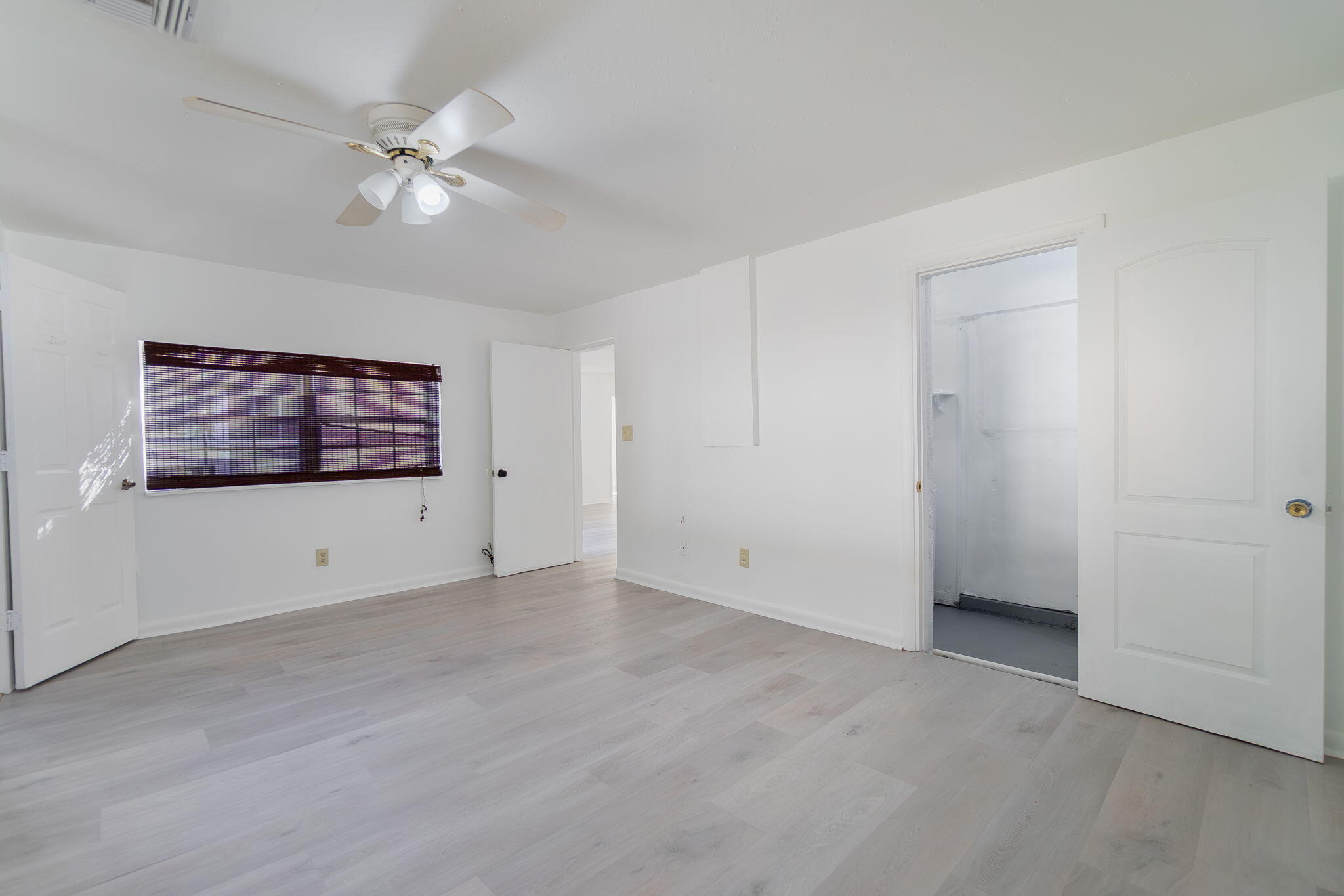5519 Southeast Normandy Avenue Stuart, FL 34997 - Photo 23 of 38 a view of an empty room with a fan