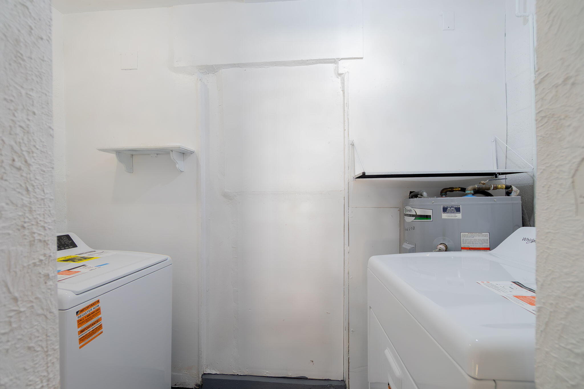 5519 Southeast Normandy Avenue Stuart, FL 34997 - Photo 25 of 38 a utility room with dryer and washer