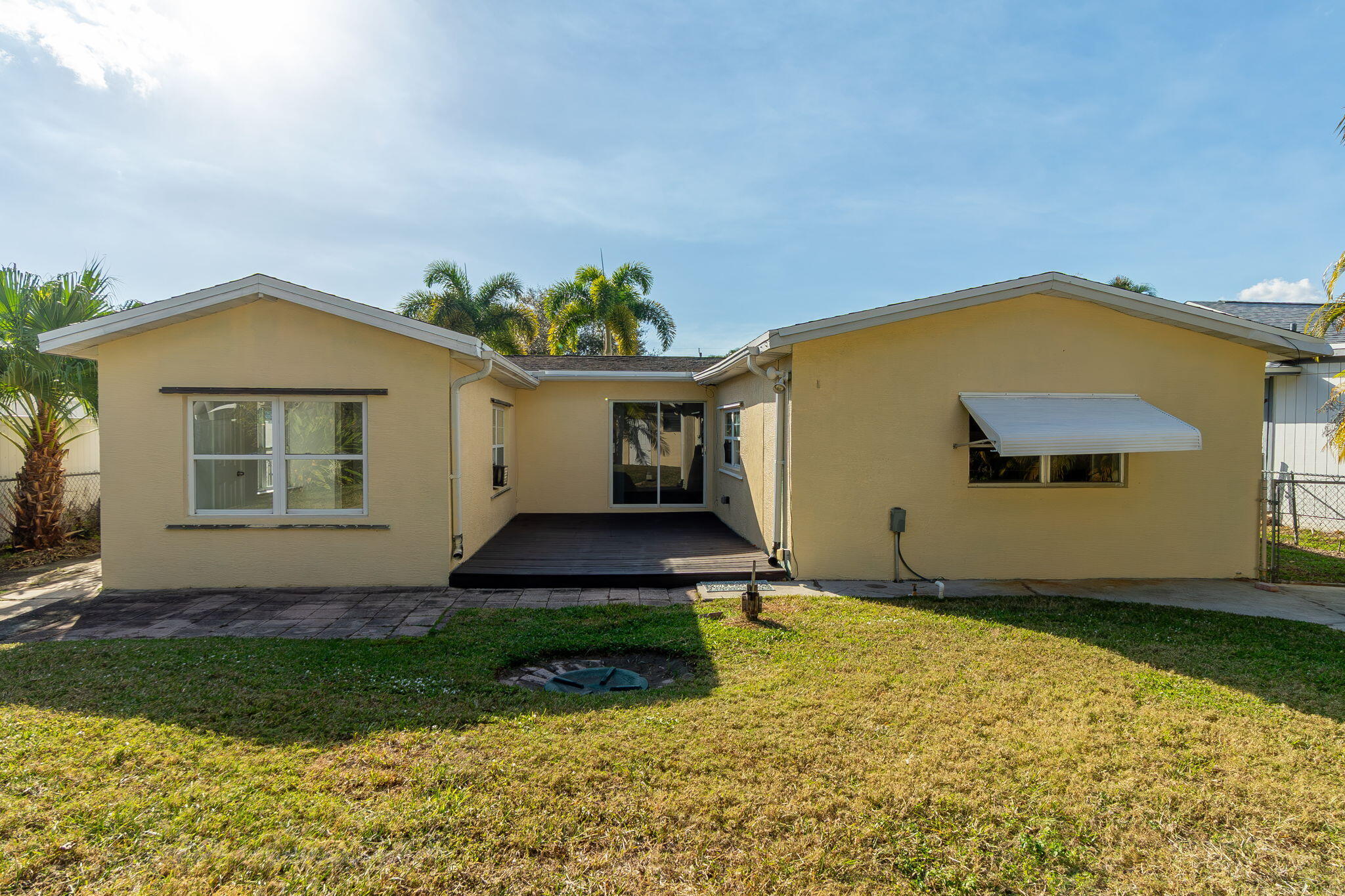 5519 Southeast Normandy Avenue Stuart, FL 34997 - Photo 26 of 38 a front view of a house with garden