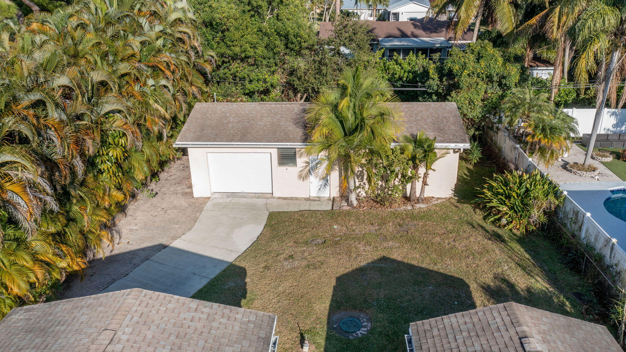 5519 Southeast Normandy Avenue Stuart, FL 34997 - Photo 27 of 38 an aerial view of a house with yard