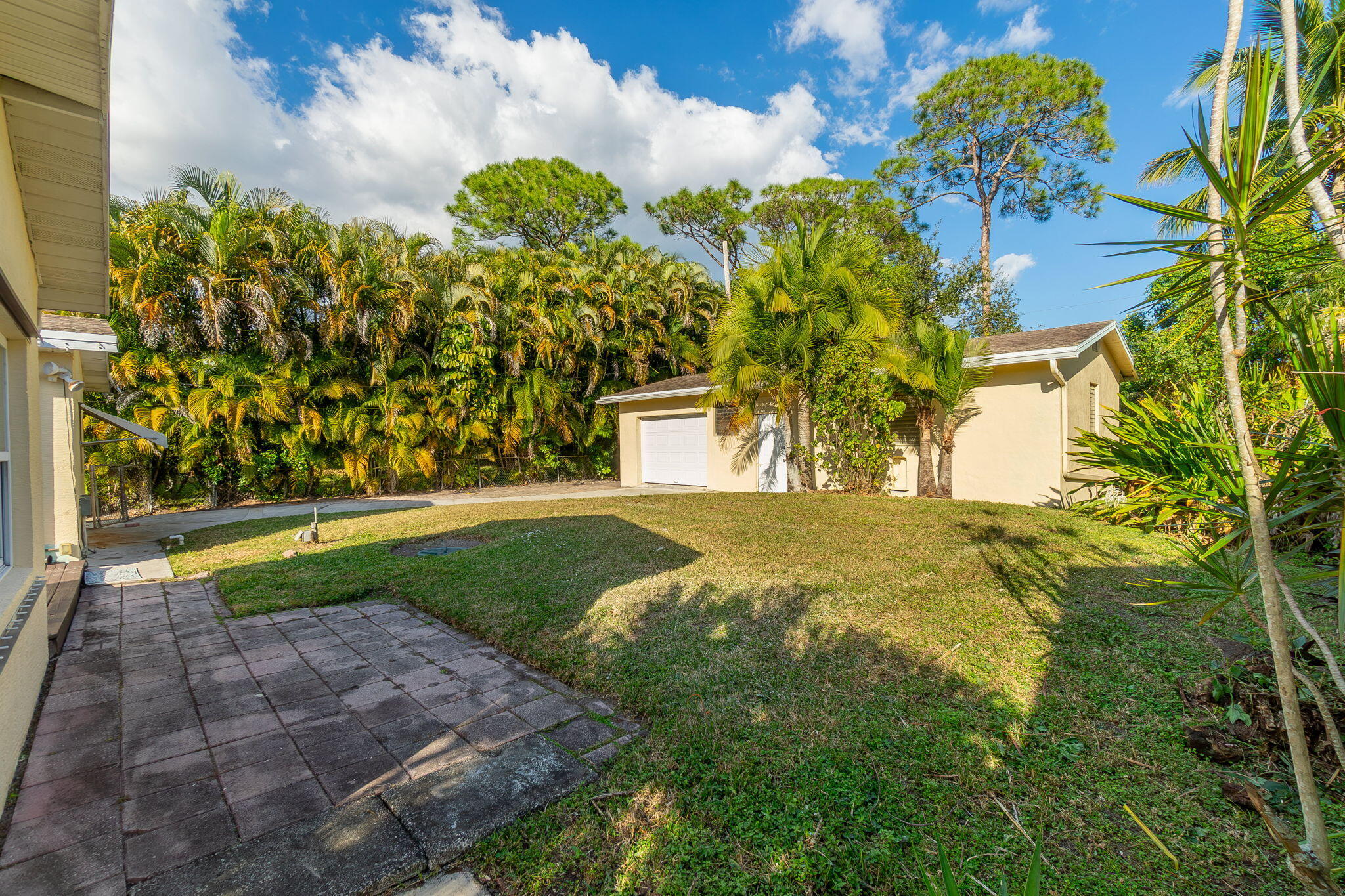 5519 Southeast Normandy Avenue Stuart, FL 34997 - Photo 28 of 38 a view of a yard