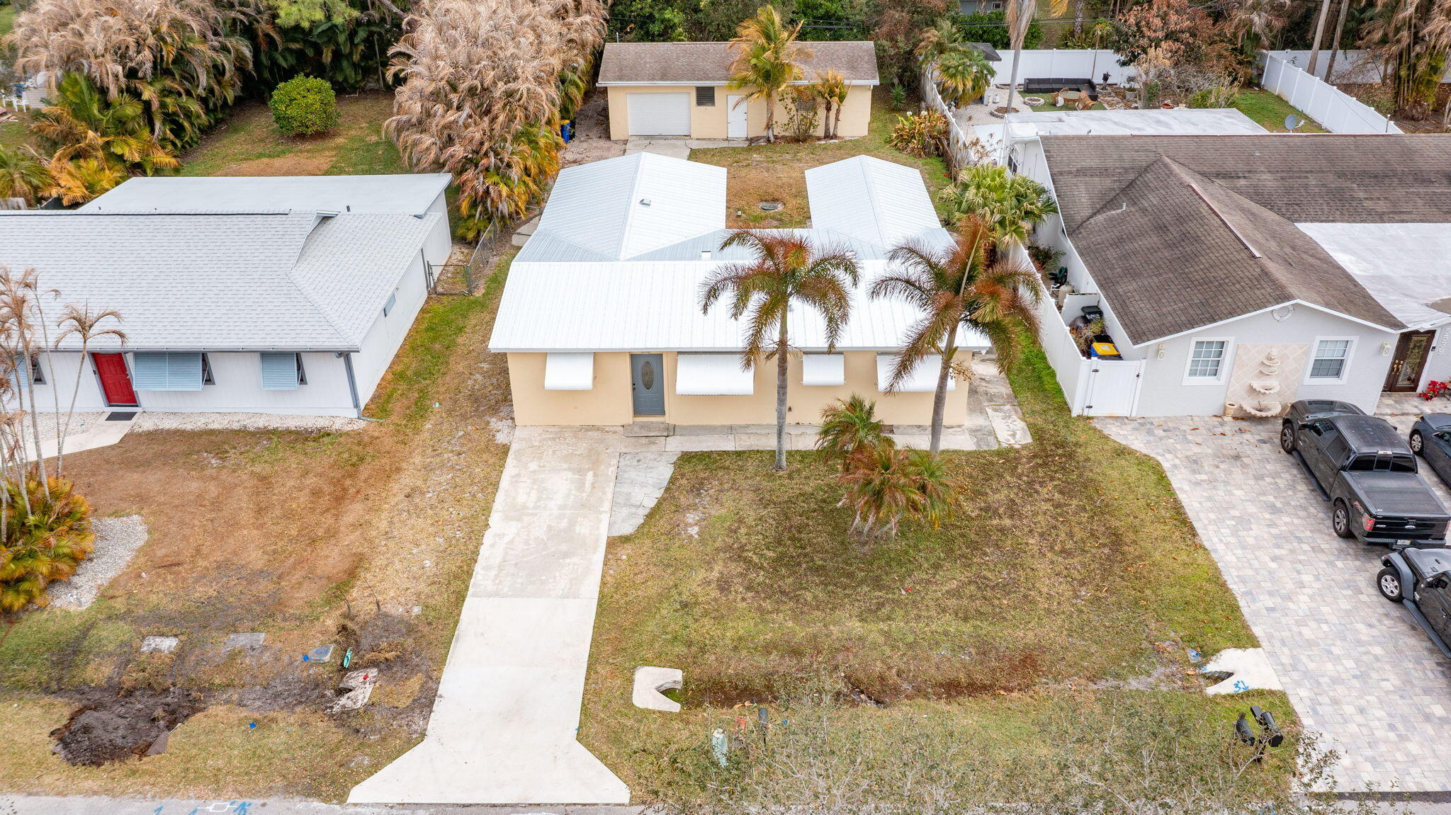 5519 Southeast Normandy Avenue Stuart, FL 34997 - Photo 30 of 38 a view of multiple houses with outdoor space