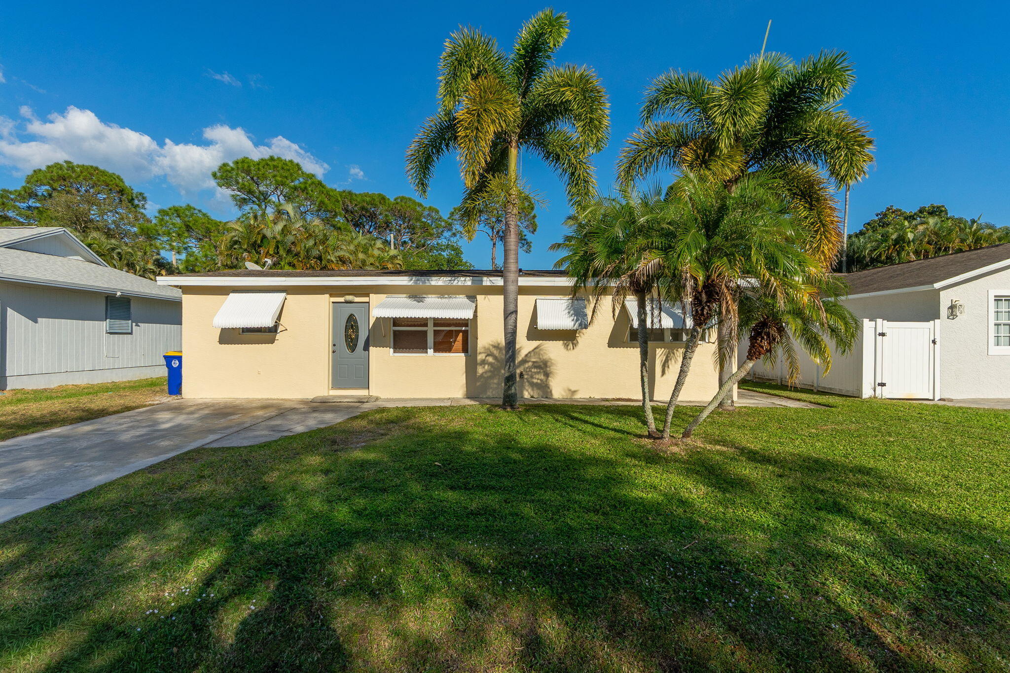 5519 Southeast Normandy Avenue Stuart, FL 34997 - Photo 3 of 38 a view of a house with a yard