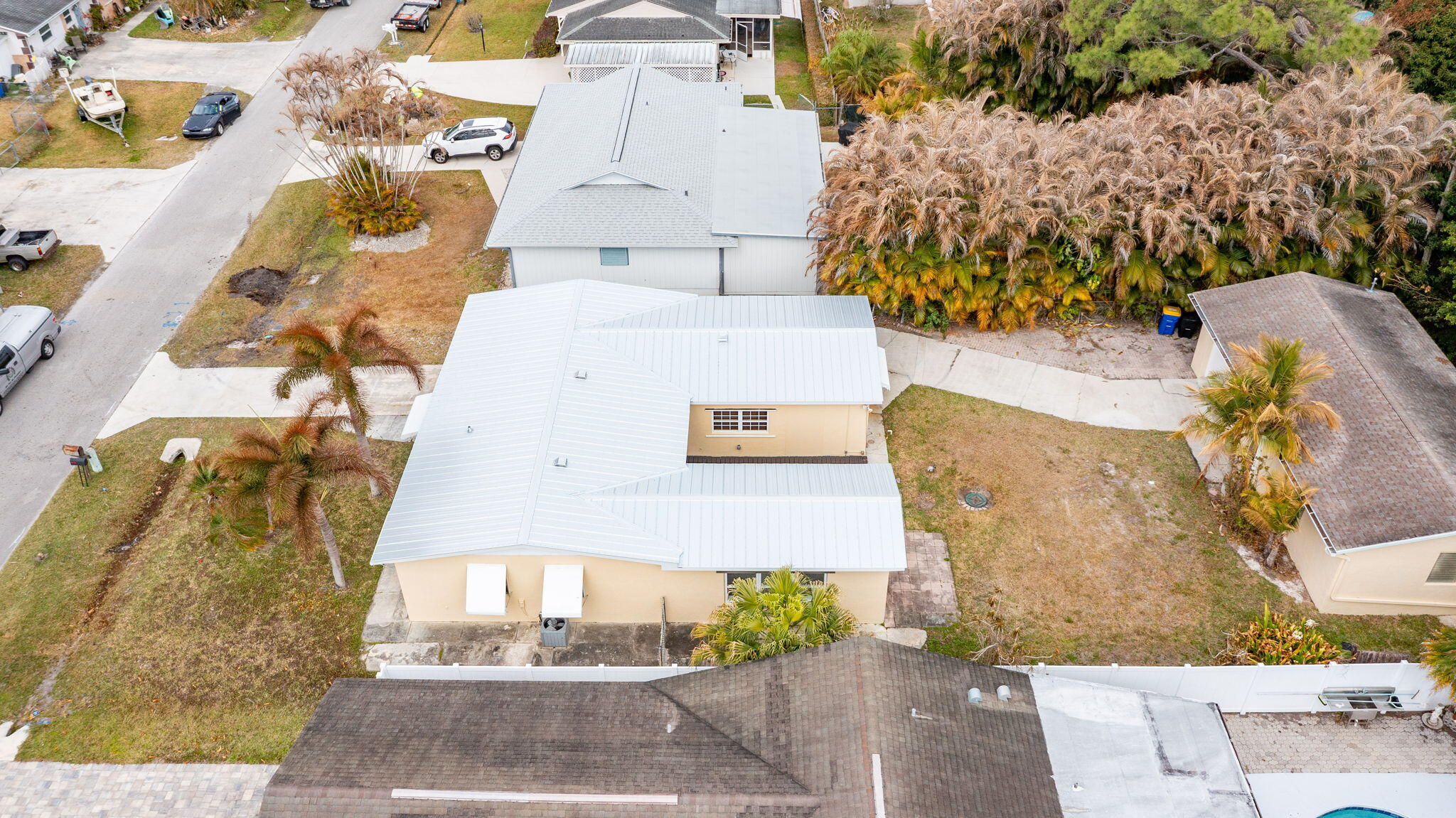 5519 Southeast Normandy Avenue Stuart, FL 34997 - Photo 31 of 38 an aerial view of a house with a swimming pool