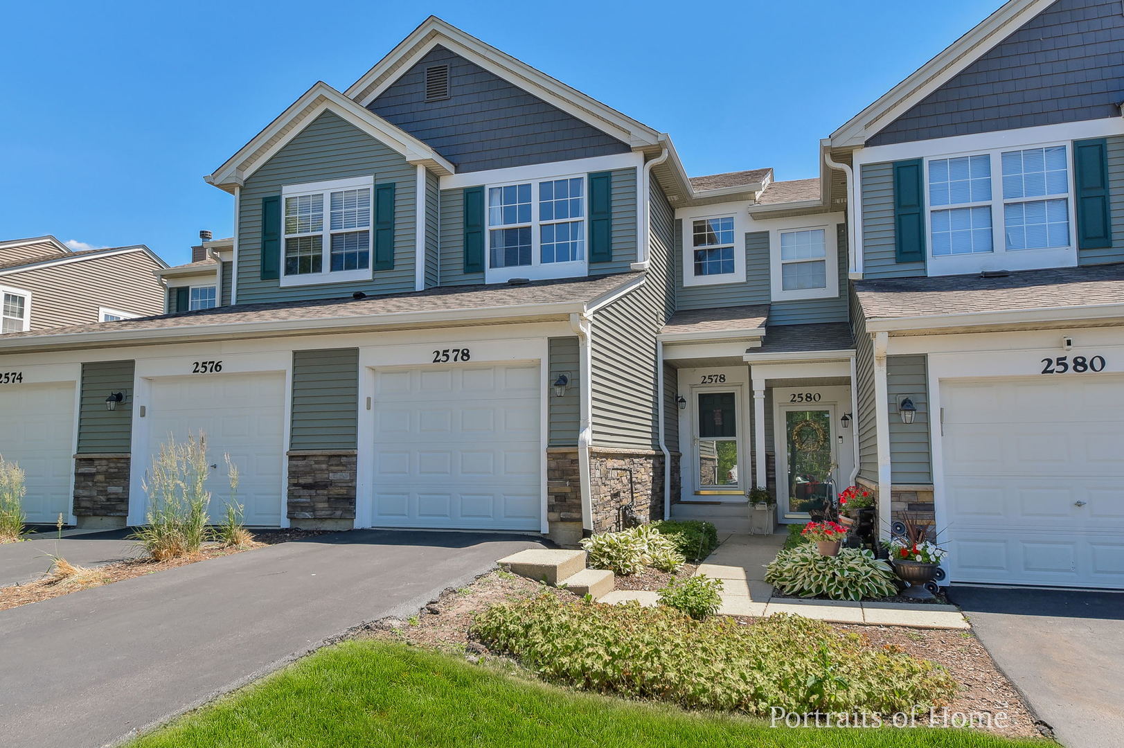 2578 Golf Ridge Circle Naperville, IL 60563 - Photo 1 of 12 a front view of a house with garden