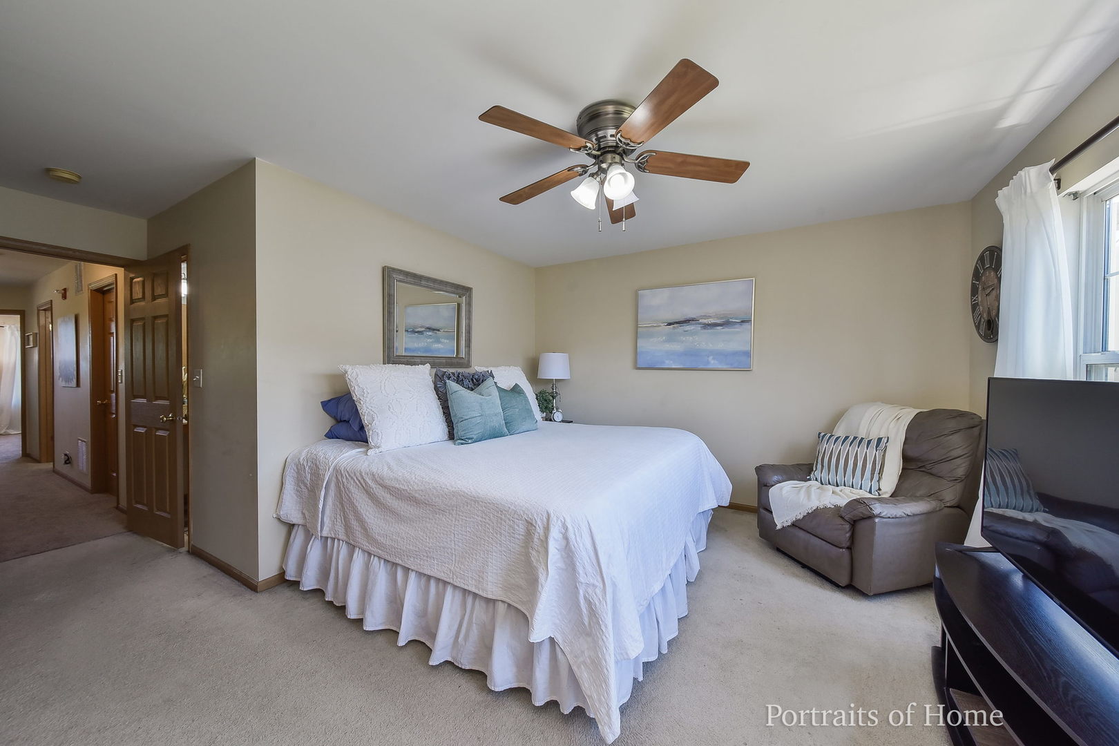 2578 Golf Ridge Circle Naperville, IL 60563 - Photo 6 of 12 a bedroom with a bed and a chandelier