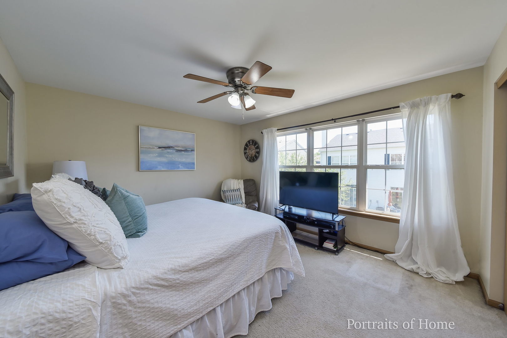 2578 Golf Ridge Circle Naperville, IL 60563 - Photo 7 of 12 a bedroom with a bed and a chandelier