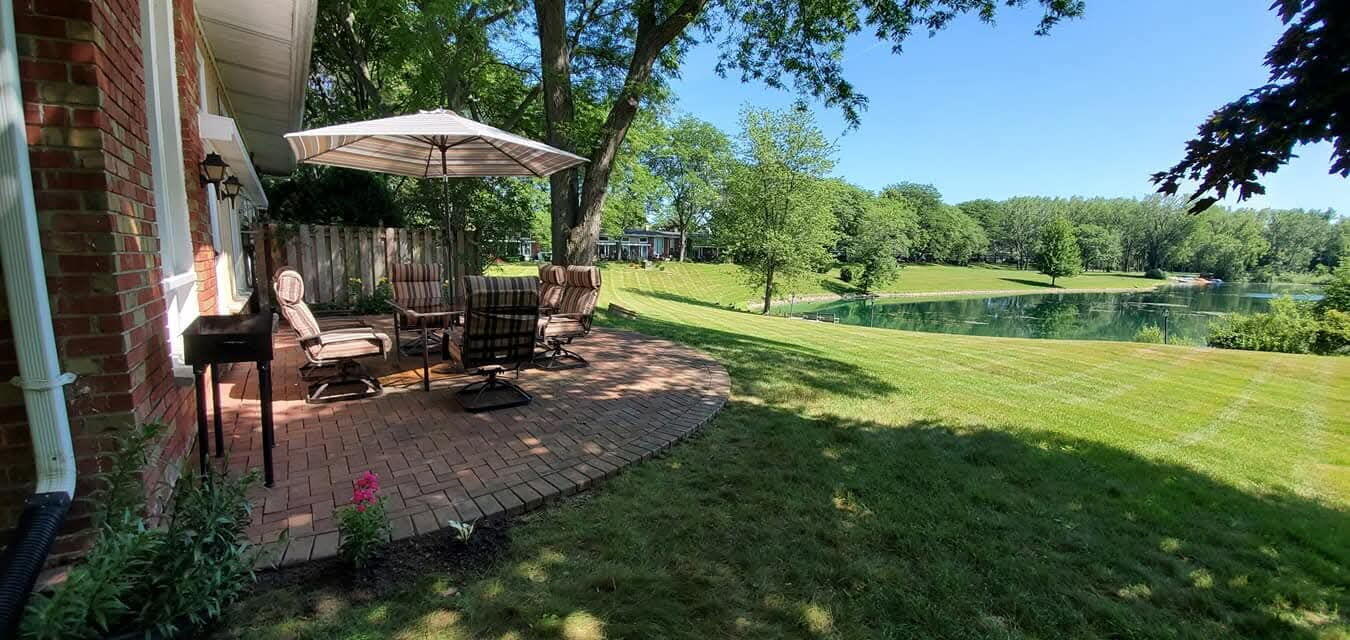 12975 North Colony Drive Mequon, WI 53097 - Photo 35 of 36 Summer Photo of Patio & Pond