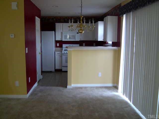 5900 Roteny Court Raleigh, NC 27610 - Photo 3 of 6 dining area leading to kitchen