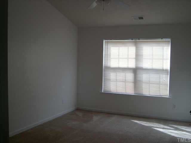 5900 Roteny Court Raleigh, NC 27610 - Photo 4 of 6 large master with vaulted ceiling, ceiling fan and walk-in closet