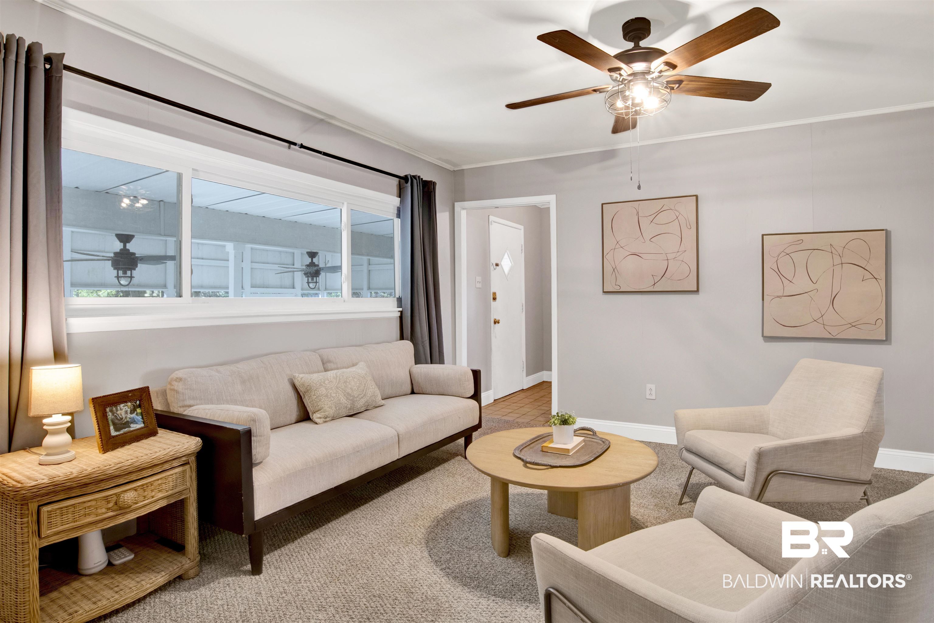 160 Emogene Place Mobile, AL 36606 - Photo 13 of 32 Carpeted living room with a ceiling fan