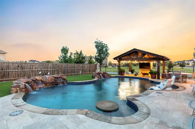 a view of a swimming pool with lounge chair