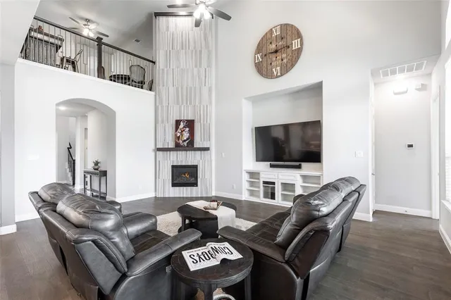 a living room with furniture and fireplace