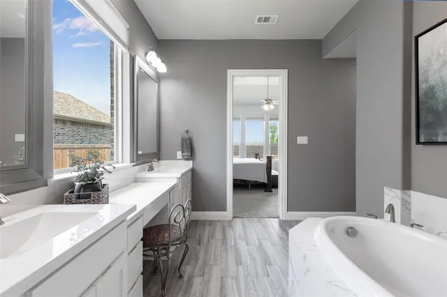 a view of walk in closet with clothes