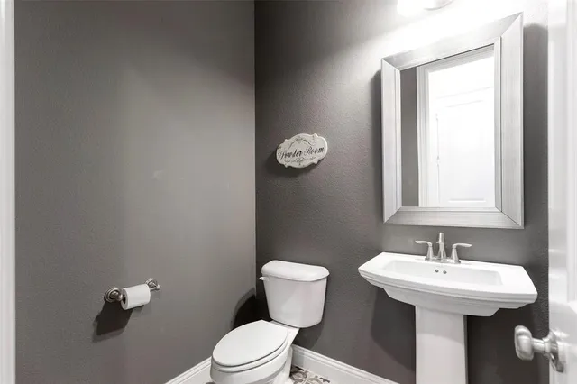 a view of a a dining room with furniture window and wooden floor