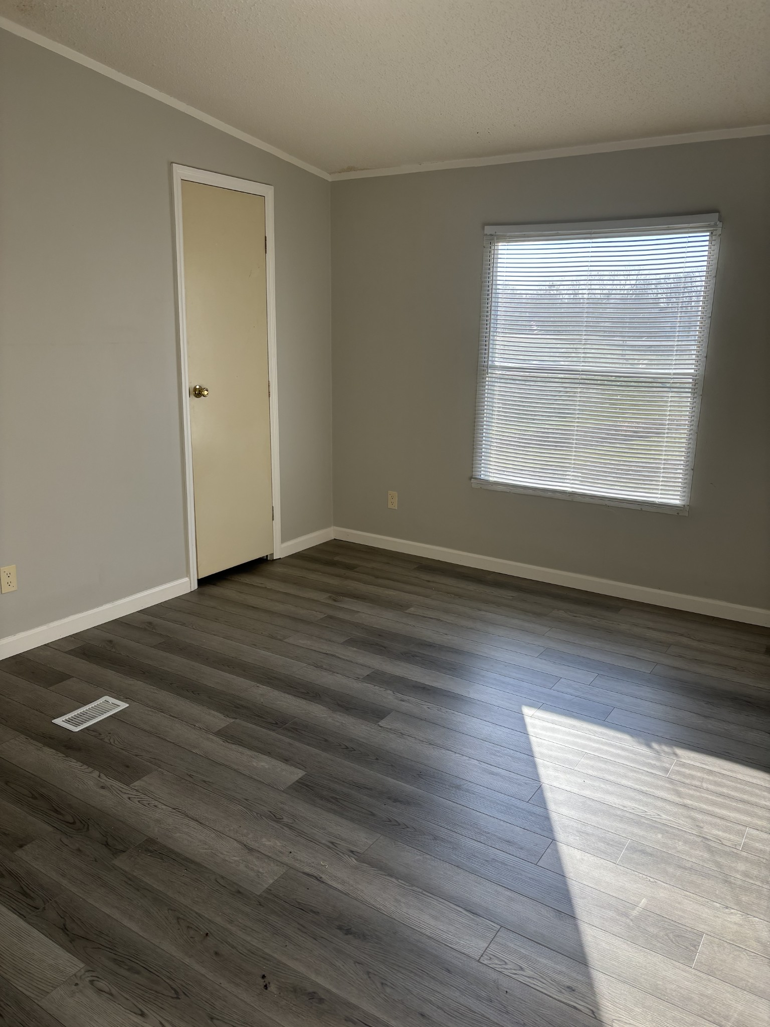2475 Canoe Branch Road Lebanon, TN 37087 - Photo 12 of 25 an empty room with wooden floor and windows