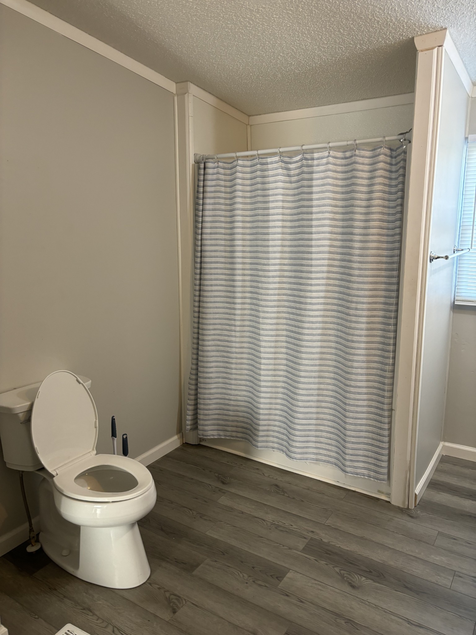 2475 Canoe Branch Road Lebanon, TN 37087 - Photo 22 of 25 a bathroom with a toilet and a shower curtain