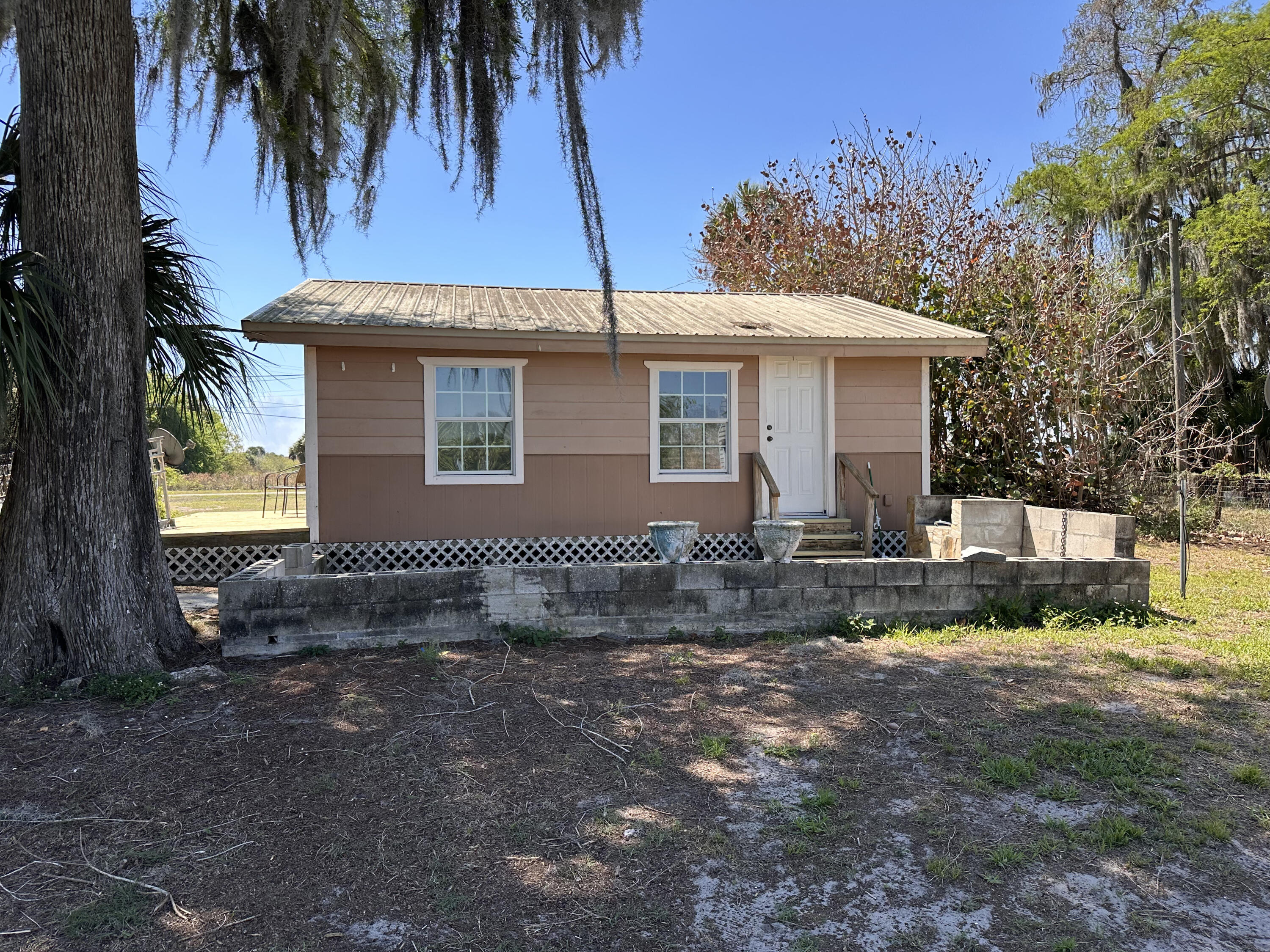14455 Highway 78 Okeechobee, FL 34974 - Photo 1 of 14 a view of a house with a yard