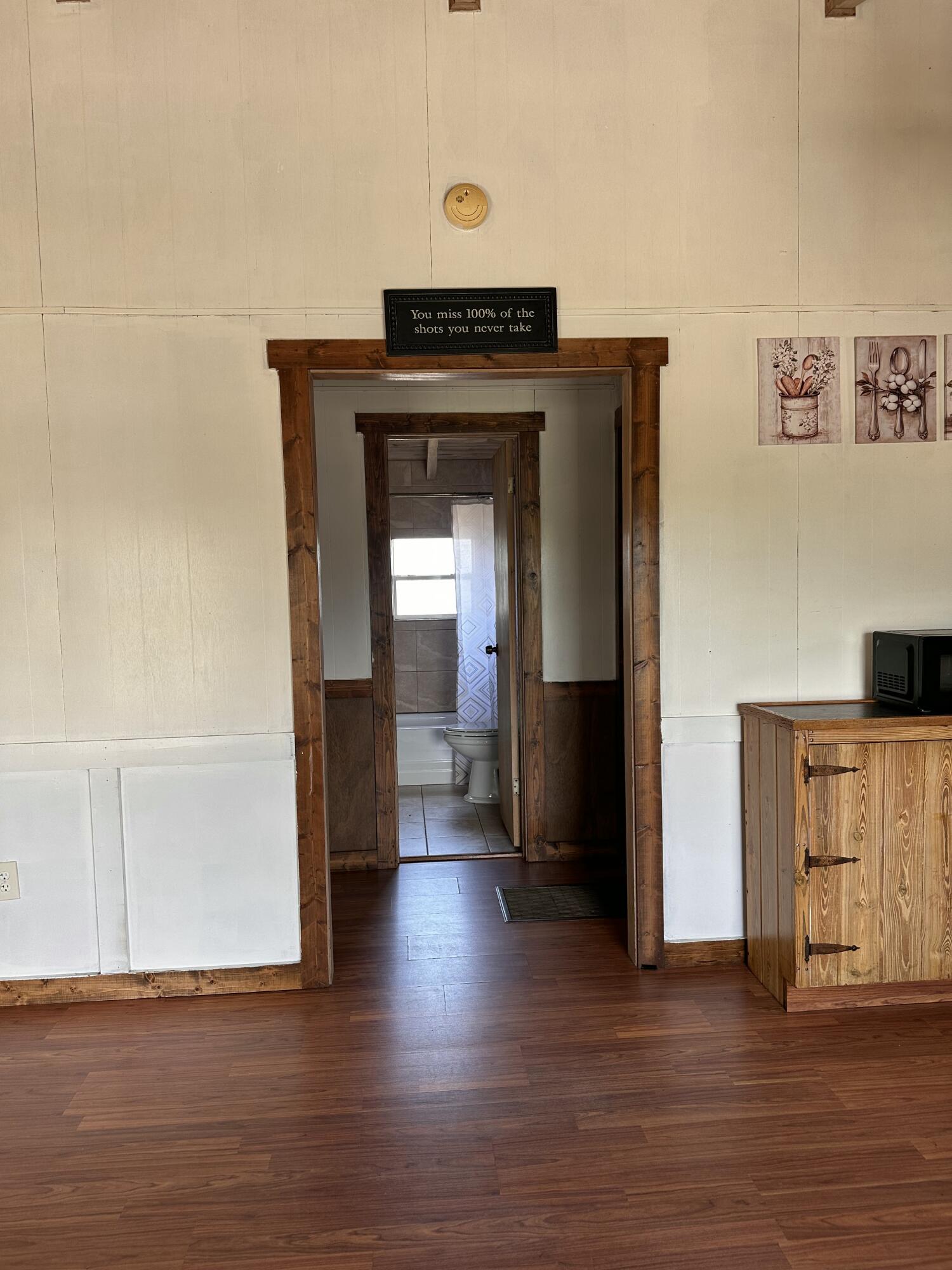 14455 Highway 78 Okeechobee, FL 34974 - Photo 4 of 14 a view of a hallway with wooden floor
