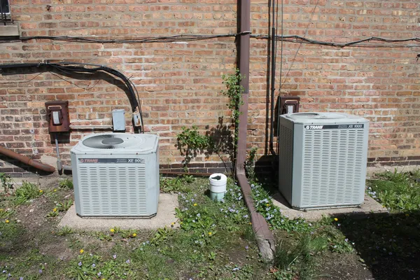 a backyard of a house with barbeque oven