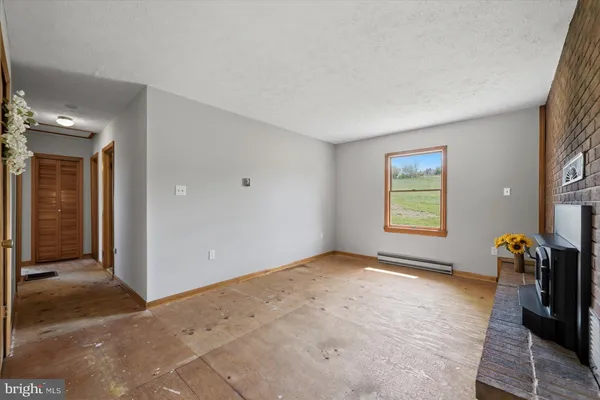 a large house with a big yard and large trees