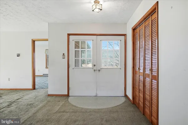 a view of balcony with wooden floor and fence