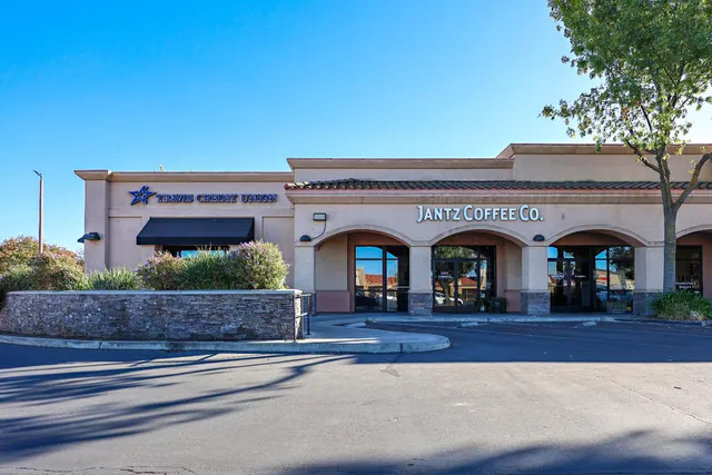 a building with cars parked in front of it