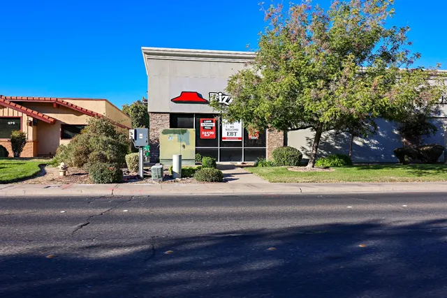 a view of a building with a street