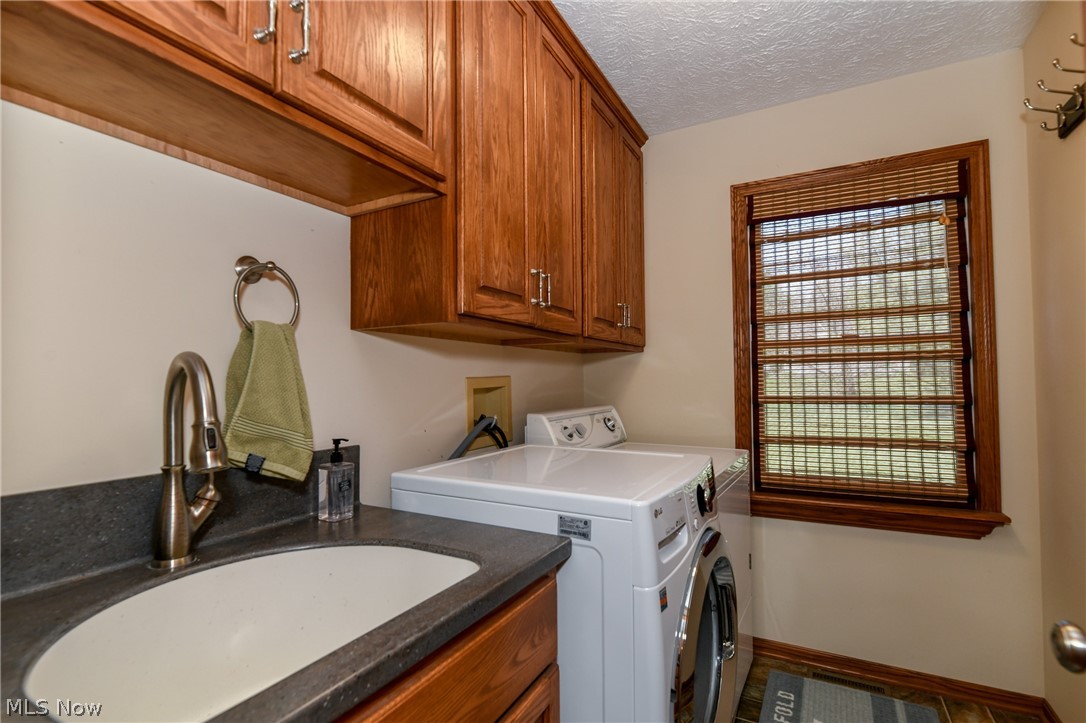 7810 Kennard Road Lodi, OH 44254 - Photo 12 of 35 1st floor laundry in the hall next to the kitchen!