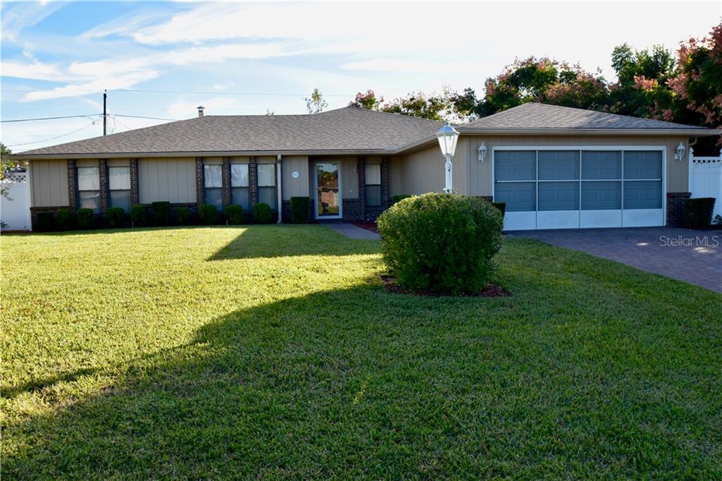1830 Dublin Road Deltona, FL 32738 - Photo 1 of 1 a view of a house with a yard