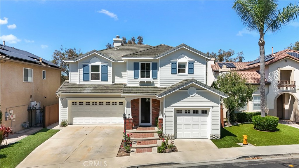 29 Spring View Way Rancho Santa Margarita, CA 92688 - Photo 1 of 1 a front view of a house with a yard and garage