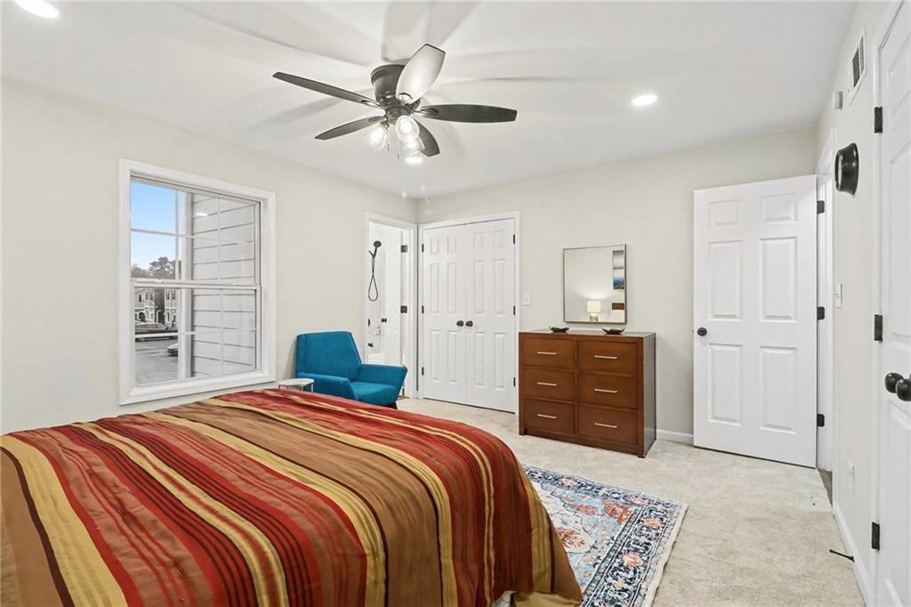 616 Summer Place Northwest Norcross, GA 30071 - Photo 15 of 24 a bedroom with a bed and a dresser
