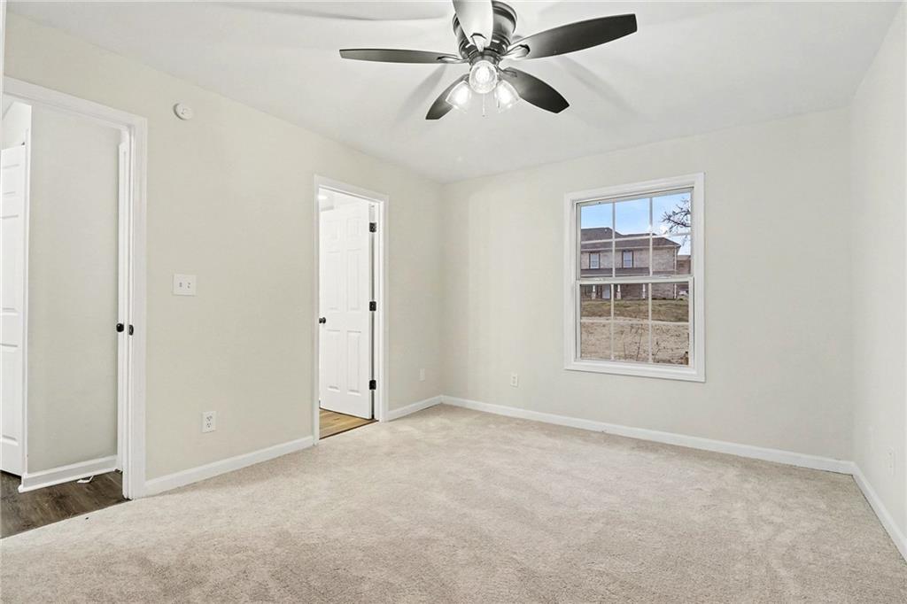 616 Summer Place Northwest Norcross, GA 30071 - Photo 19 of 24 an empty room with windows and fan
