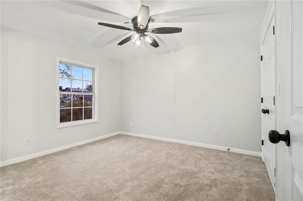 616 Summer Place Northwest Norcross, GA 30071 - Photo 20 of 24 a view of an empty room with a window