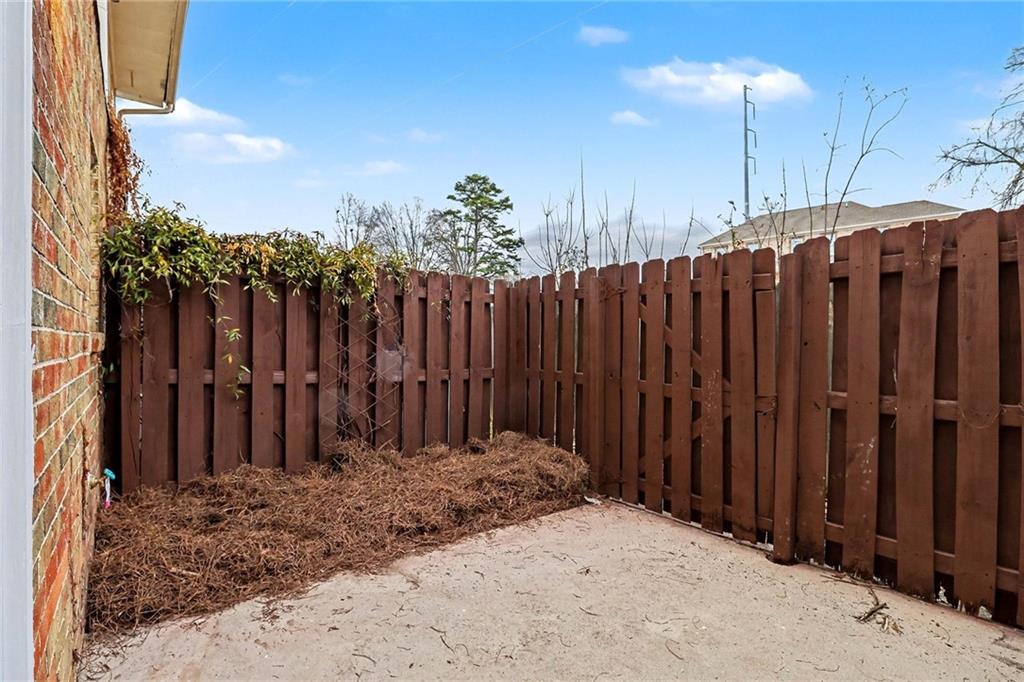 616 Summer Place Northwest Norcross, GA 30071 - Photo 23 of 24 a view of a wooden fence