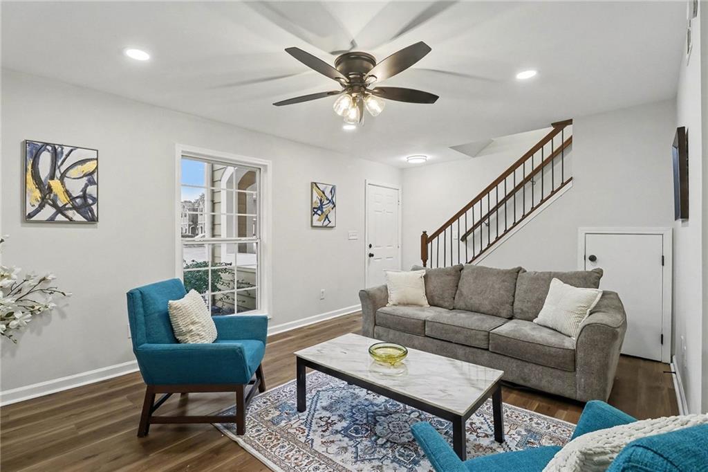 616 Summer Place Northwest Norcross, GA 30071 - Photo 3 of 24 a living room with furniture and a ceiling fan