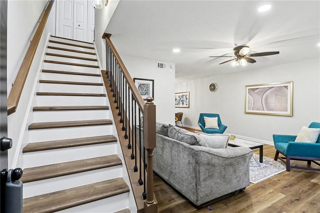 616 Summer Place Northwest Norcross, GA 30071 - Photo 6 of 24 a living room with furniture and a chandelier